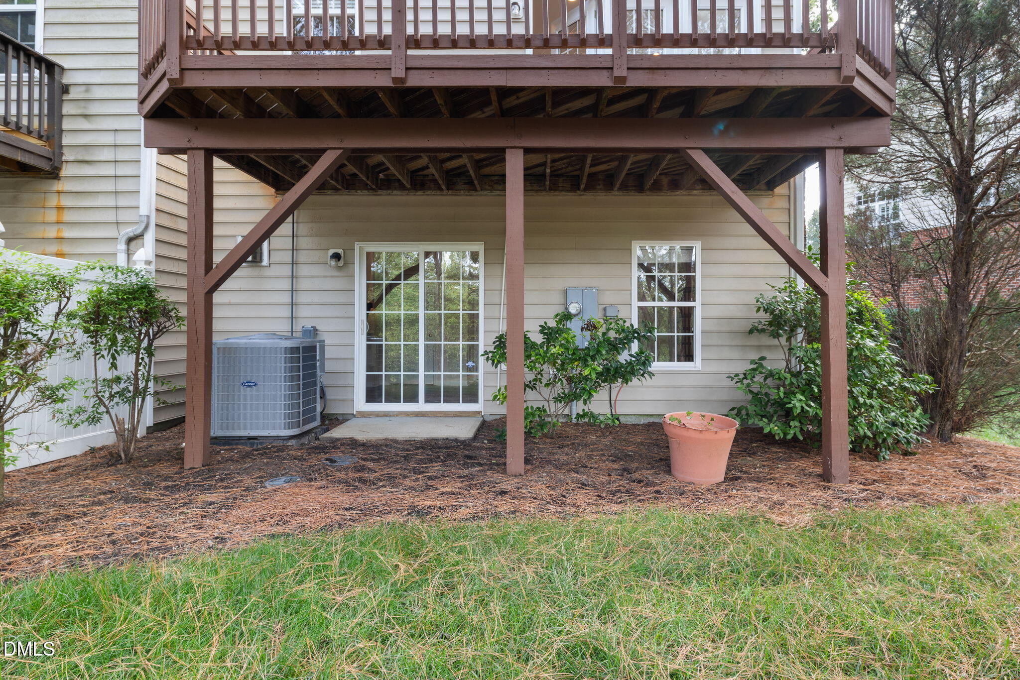 6901 Middleboro Drive Raleigh, NC 27612 - Photo 6 of 42 a front view of a house with a garden