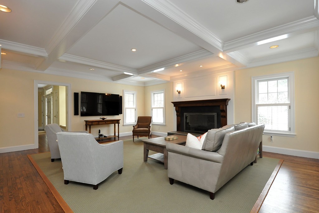 19 Meadowbrook Road Weston, MA 02493 - Photo 13 of 30 a living room with furniture a flat screen tv and a fireplace