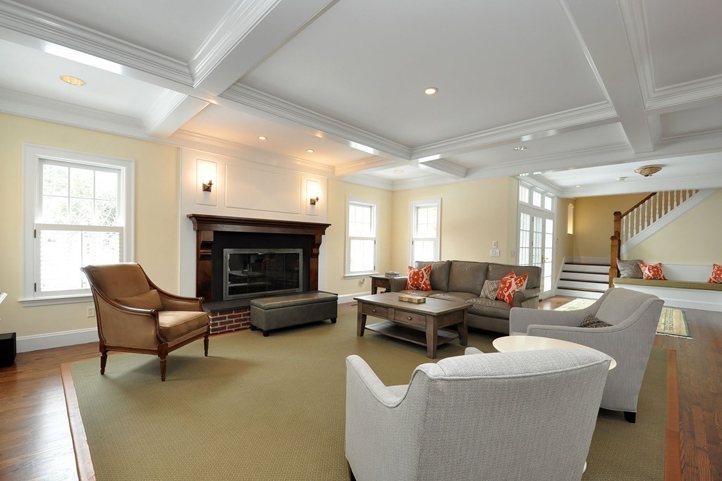 19 Meadowbrook Road Weston, MA 02493 - Photo 16 of 30 a living room with furniture a fireplace and a large window