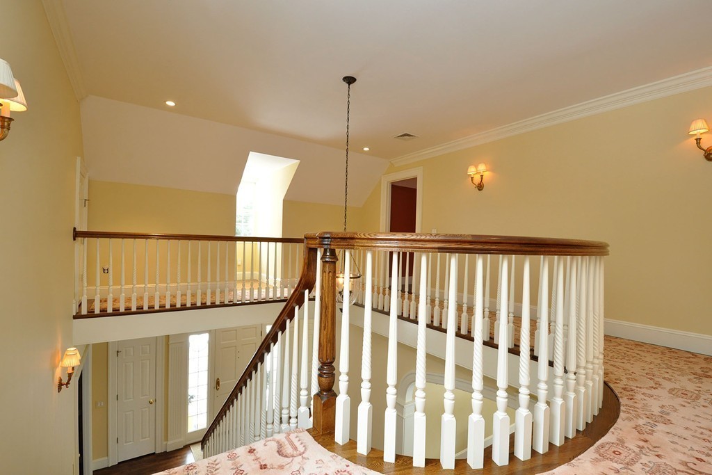19 Meadowbrook Road Weston, MA 02493 - Photo 26 of 30 a view of staircase with railing and a chandelier