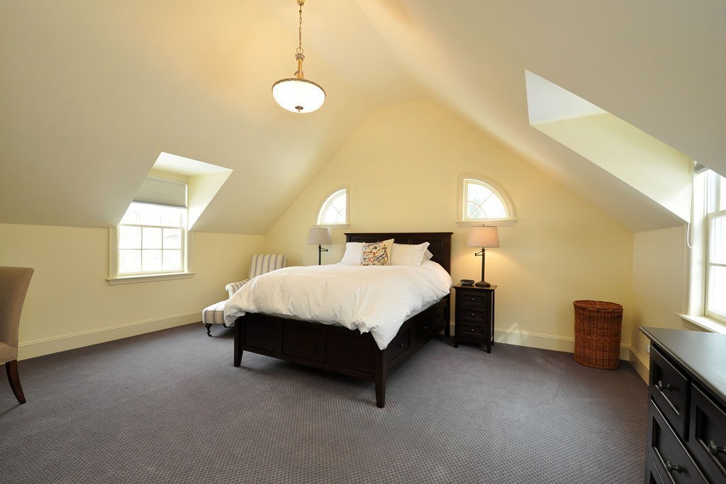19 Meadowbrook Road Weston, MA 02493 - Photo 27 of 30 a bed sitting in a room next to a window