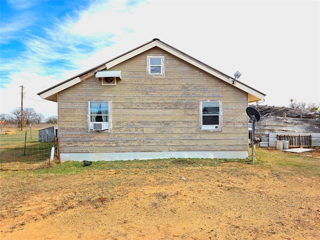4451 Farm To Market 585 Bangs, TX 76823 - Photo 39 of 40 a front view of a house with a yard