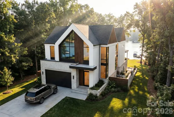 a front view of a house with a yard table and chairs