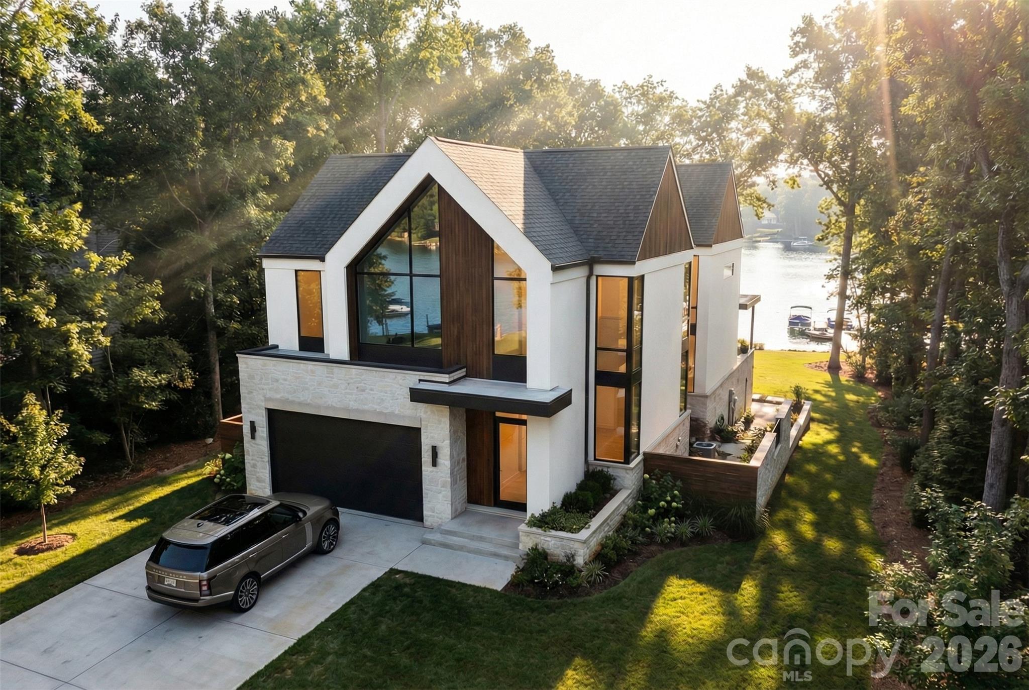 21510 Rio Oro Drive Cornelius, NC 28031 - Photo 3 of 3 a front view of a house with a yard table and chairs