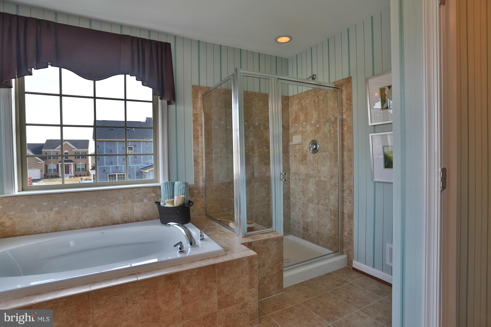 4326 Chapel Road Perry Hall, MD 21128 - Photo 22 of 30 a bathroom with a tub a sink and a large window