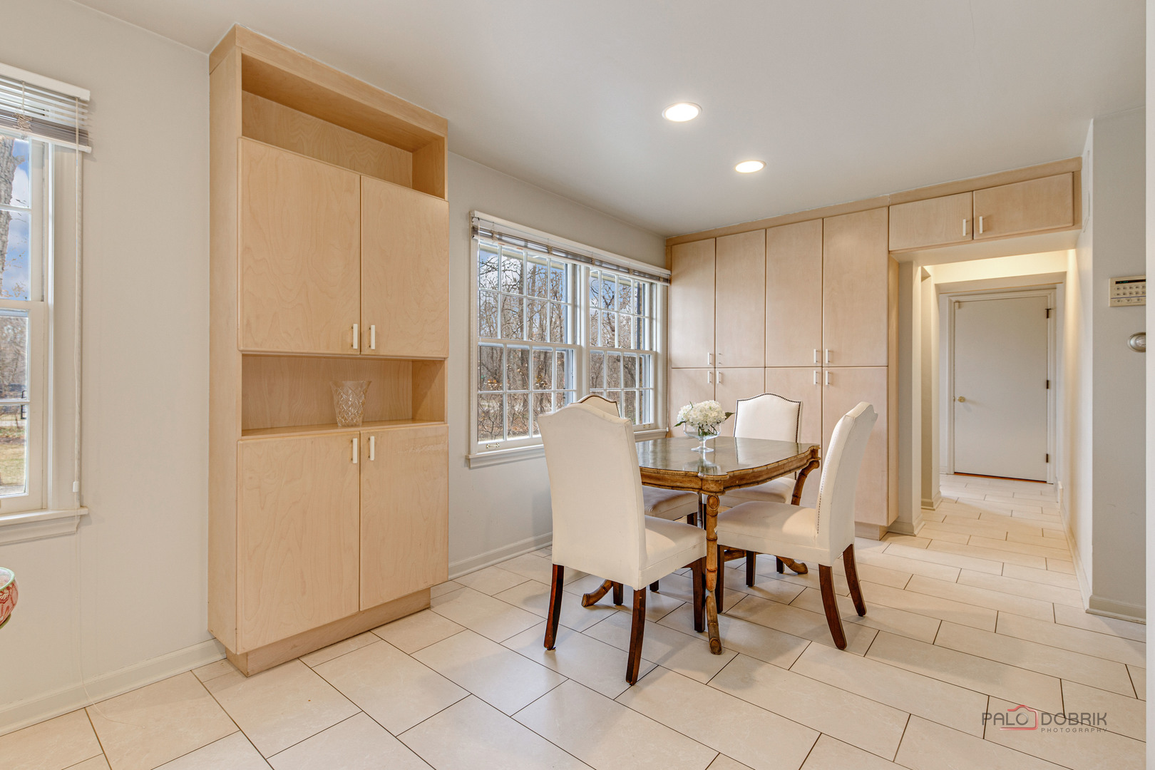10 North Mayflower Road Lake Forest, IL 60045 - Photo 13 of 38 a view of a dining room with furniture and a window