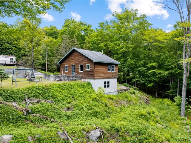 $449,900 | 146 Mohawk Drive West, Webb, NY 13420