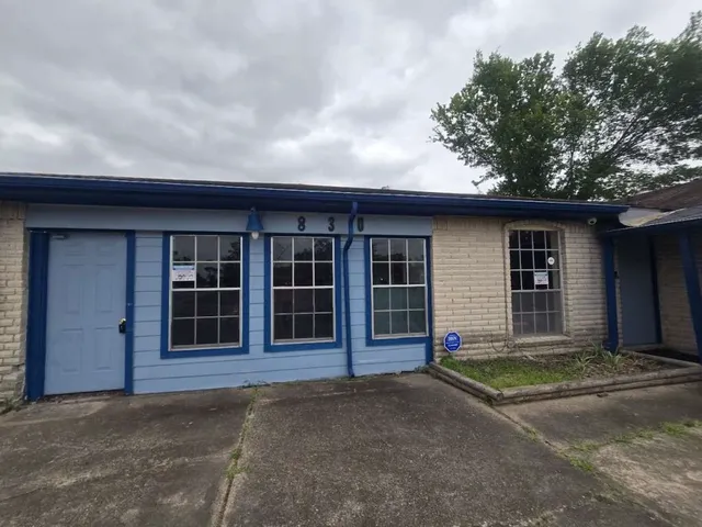 a front view of a house with a garage