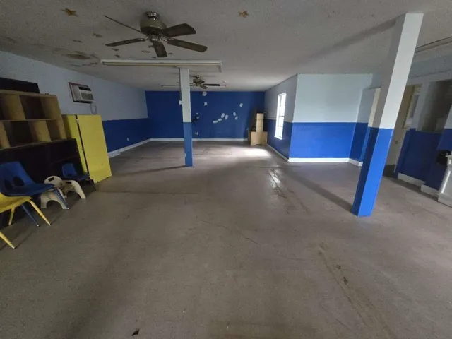 a view of a livingroom with furniture and a flat screen tv