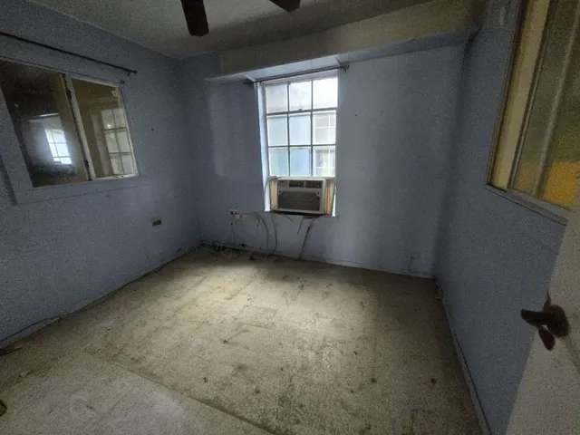 an empty room with windows