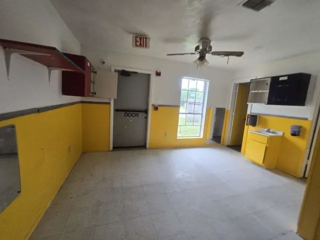 a view of an empty room with a window