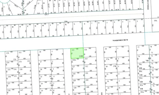 a black white and white photo of a bathroom