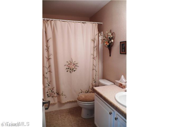 485 Riverview Rd Extension Lexington, NC 27292 - Photo 13 of 16 Bath. Hall bath is next to 2nd bedroom and across the hall from den/3rd bedroom. Large vanity with single sink. Tub/Shower unit.