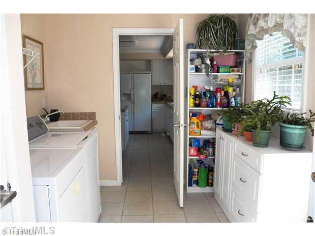 485 Riverview Rd Extension Lexington, NC 27292 - Photo 14 of 16 Laundry Room. Large laundry room with deep sink, window to back yard, door to back deck, coat closet and space to put extra storage cabinets and shelves. Tile floor for easy clean up.