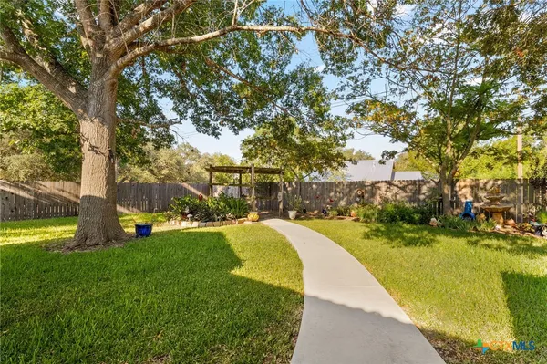 a view of a park with large trees
