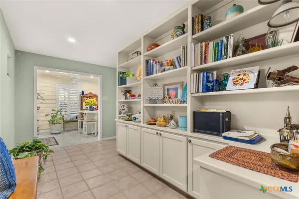 a room with furniture and a book shelf