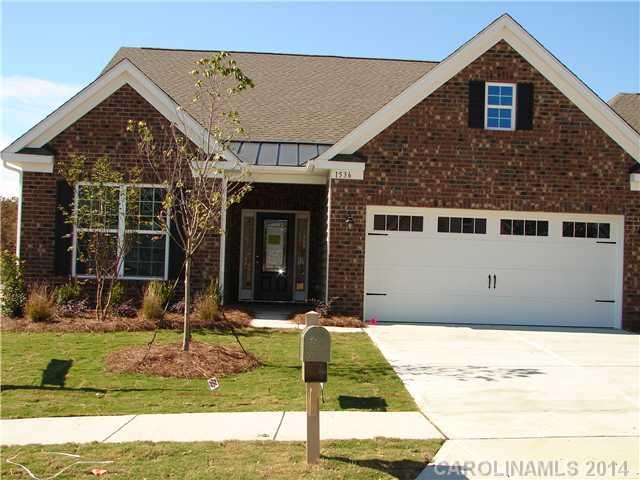 4110 Perth Road, Unit 225 Indian Land, SC 29707 - Photo 1 of 6 a front view of a house with garden
