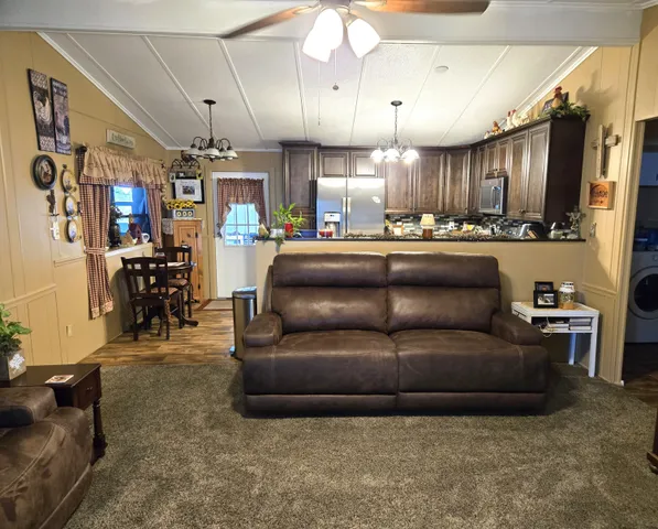a kitchen with a sink and a granite counter top