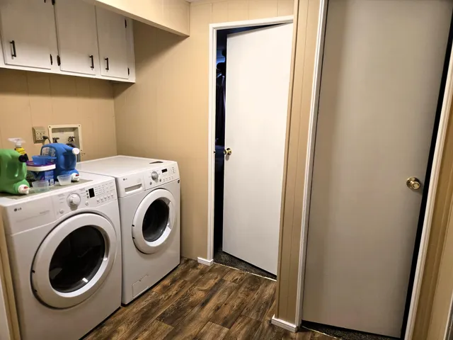 a view of entryway livingroom and hall with wooden floor