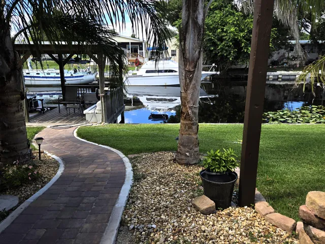 an aerial view of residential houses with outdoor space and swimming pool