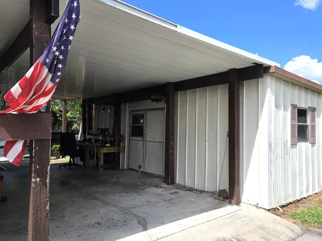 an aerial view of residential house with outdoor space and parking