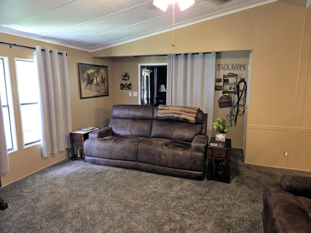 a living room with furniture and a window