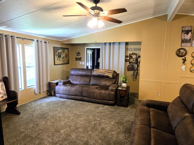 a living room with furniture and a table