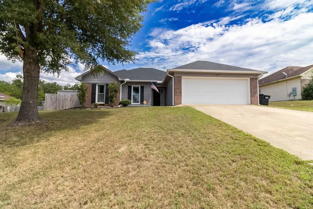 front view of a house with a yard