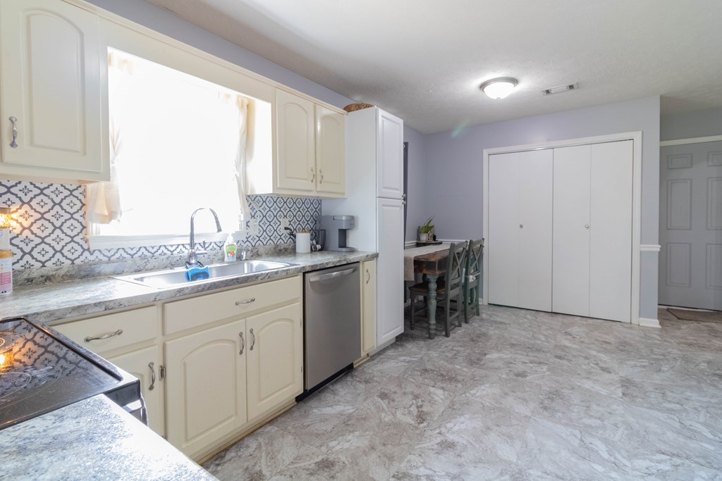 3381 Flintlock Drive Columbus, GA 31907 - Photo 18 of 39 a kitchen with a sink and cabinets