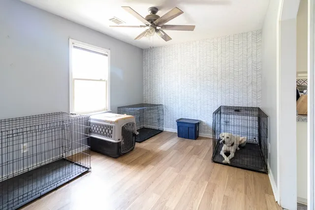 a bedroom with furniture and a window