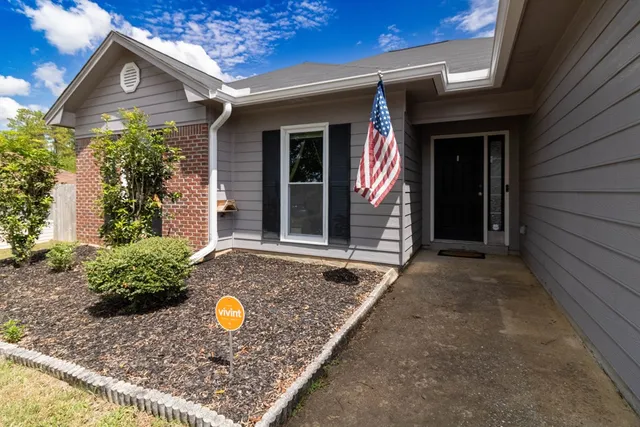 front view of a house with a yard