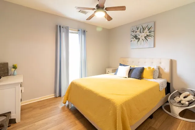 a bedroom with a bed and a window