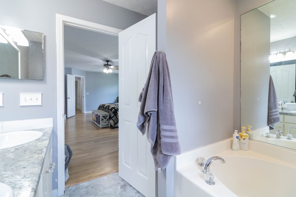 3381 Flintlock Drive Columbus, GA 31907 - Photo 30 of 39 a bathroom with a tub sink and mirror