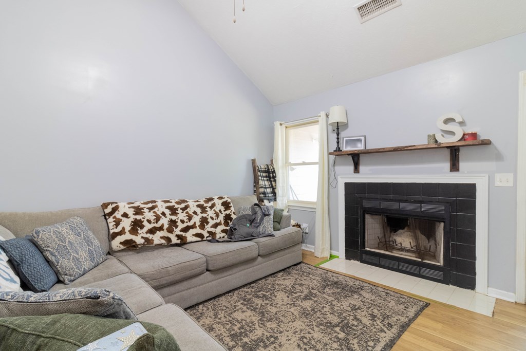3381 Flintlock Drive Columbus, GA 31907 - Photo 31 of 39 a living room with furniture and a fireplace