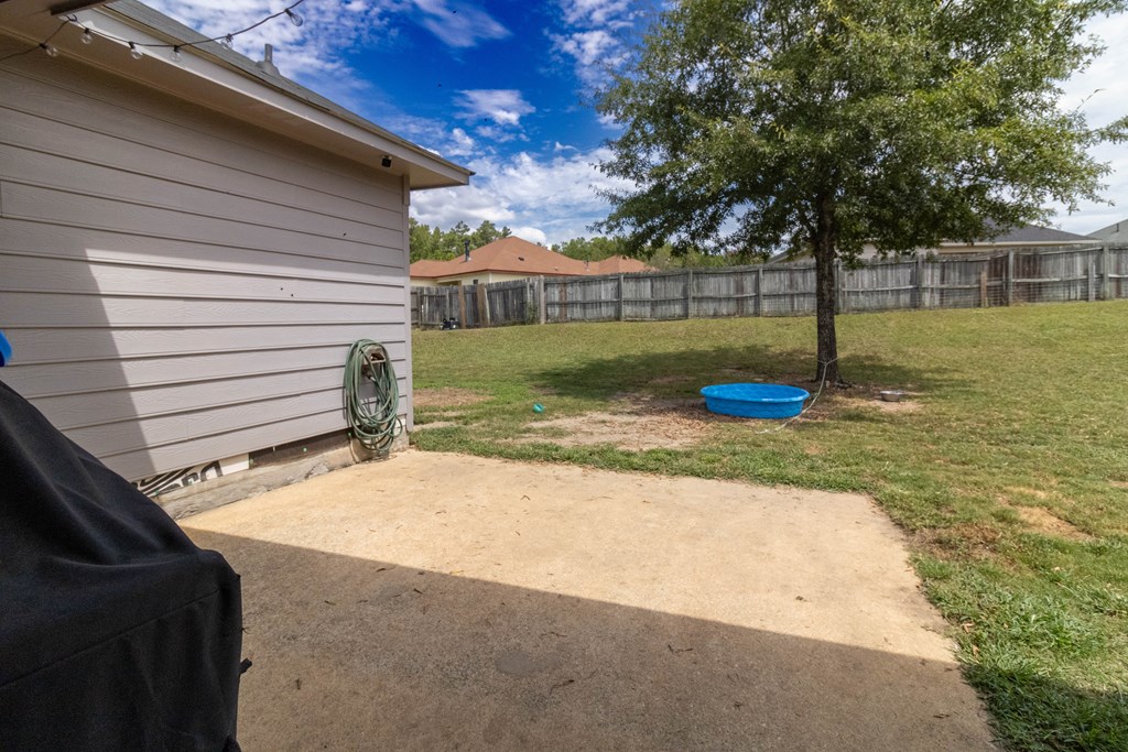 3381 Flintlock Drive Columbus, GA 31907 - Photo 32 of 39 a view of a backyard with a garden
