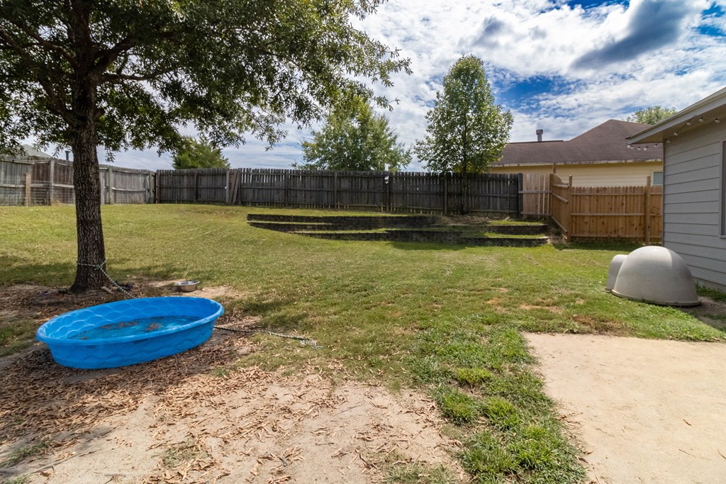 3381 Flintlock Drive Columbus, GA 31907 - Photo 35 of 39 a view of a backyard with swimming pool
