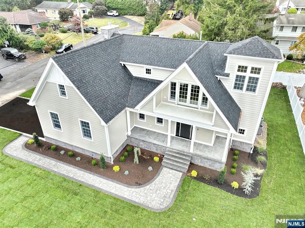 an aerial view of a house with swimming pool