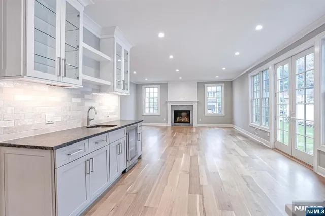 a kitchen with stainless steel appliances granite countertop a stove and a sink