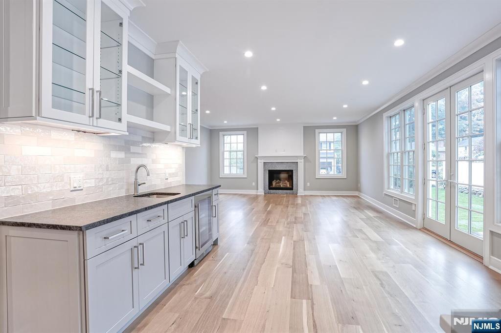 57 Mill Road Park Ridge, NJ 07656 - Photo 11 of 50 a kitchen with granite countertop a stove top oven a sink a counter space and cabinets