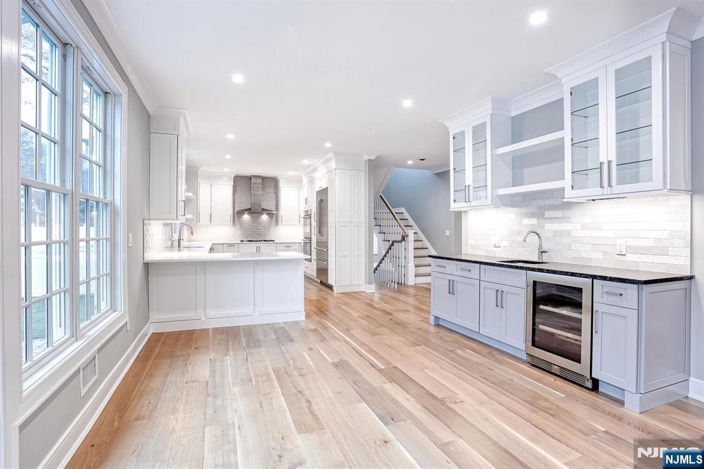 57 Mill Road Park Ridge, NJ 07656 - Photo 12 of 50 a kitchen with stainless steel appliances granite countertop a stove and a sink