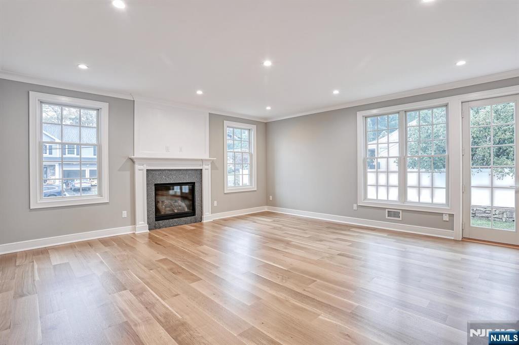 57 Mill Road Park Ridge, NJ 07656 - Photo 14 of 50 a view of an empty room with wooden floor and a window