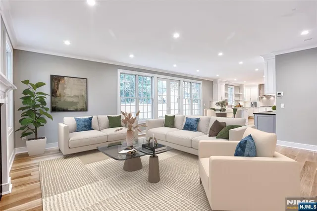 a bathroom with a granite countertop toilet and sink