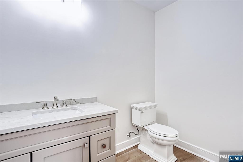57 Mill Road Park Ridge, NJ 07656 - Photo 16 of 50 a bathroom with a granite countertop toilet and sink