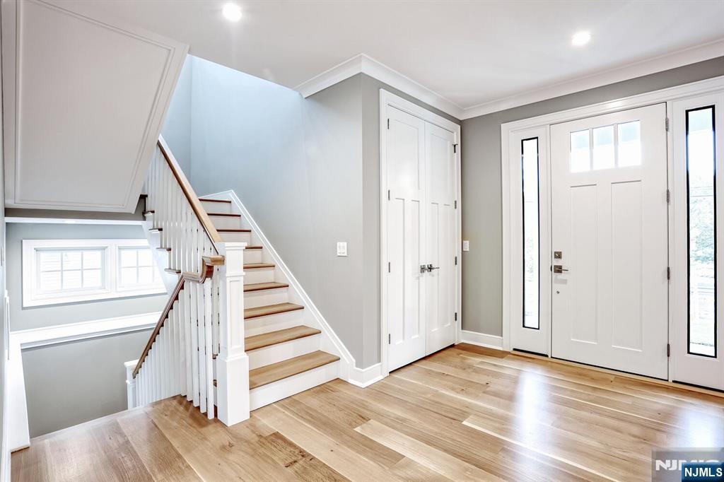 57 Mill Road Park Ridge, NJ 07656 - Photo 17 of 50 a view of a hallway with wooden floor and staircase