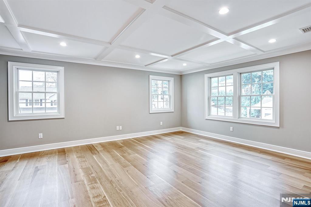57 Mill Road Park Ridge, NJ 07656 - Photo 19 of 50 a view of an empty room with wooden floor and a window