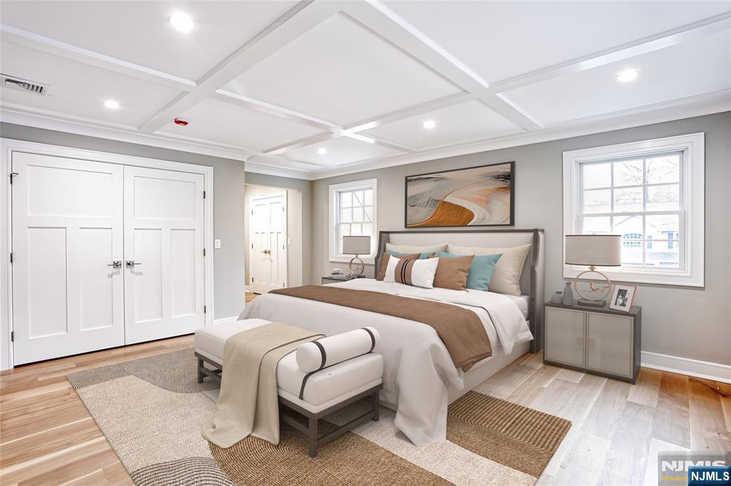 57 Mill Road Park Ridge, NJ 07656 - Photo 21 of 50 a spacious bedroom with a large bed and a window