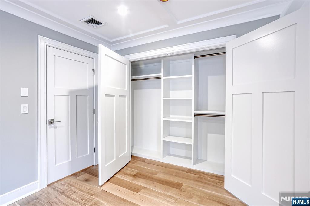 57 Mill Road Park Ridge, NJ 07656 - Photo 23 of 50 a view of a bedroom with wooden floor and closet