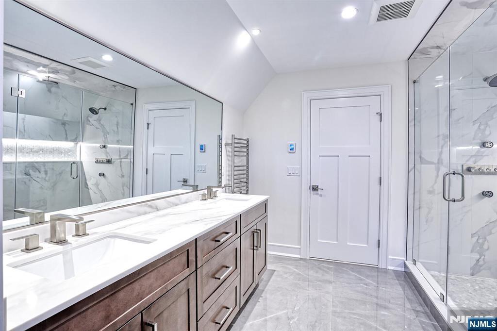 57 Mill Road Park Ridge, NJ 07656 - Photo 27 of 50 a bathroom with a sink double vanity and a mirror