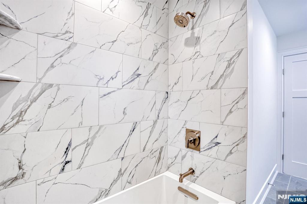 57 Mill Road Park Ridge, NJ 07656 - Photo 29 of 50 a bathroom with a bathtub