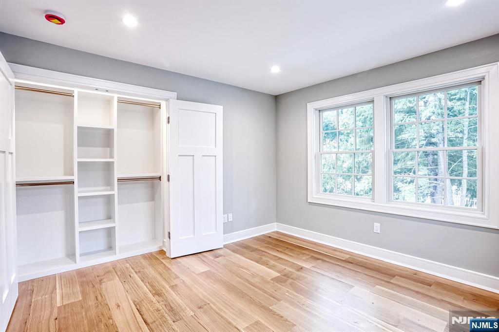 57 Mill Road Park Ridge, NJ 07656 - Photo 30 of 50 a view of empty room with wooden floor and fan